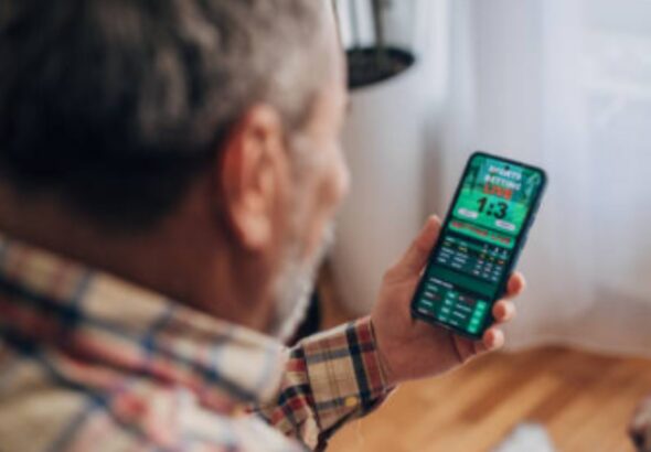 Photo of a Man Sports Betting