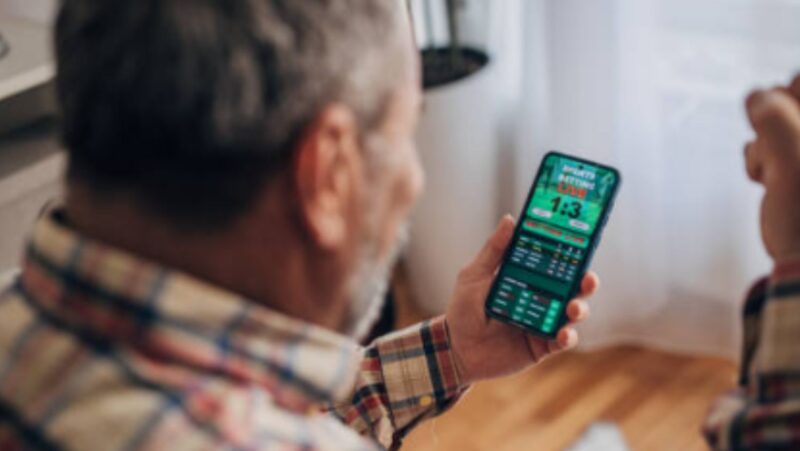 Photo of a Man Sports Betting
